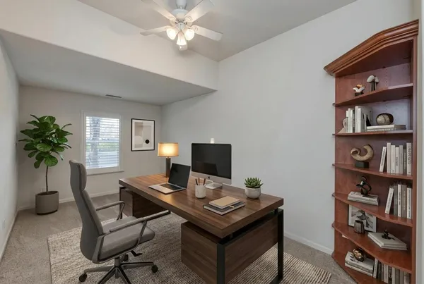 a bedroom with bed and a window