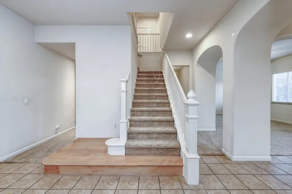 a spacious bedroom with a bed and furniture