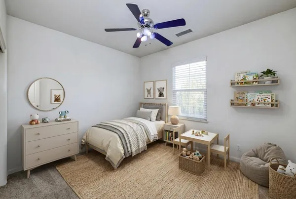 a bedroom with a bed and a chandelier