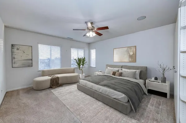 a spacious bathroom with a double vanity sink a large mirror and a bathtub