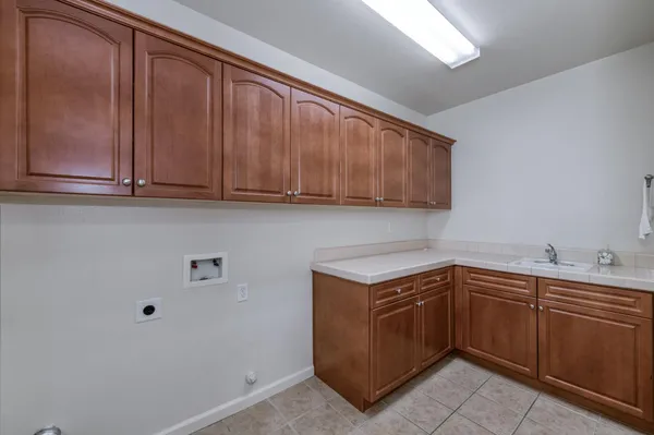 an aerial view of residential houses with outdoor space and street view