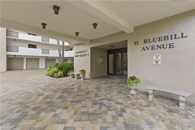 a kitchen with granite countertop a table and chairs