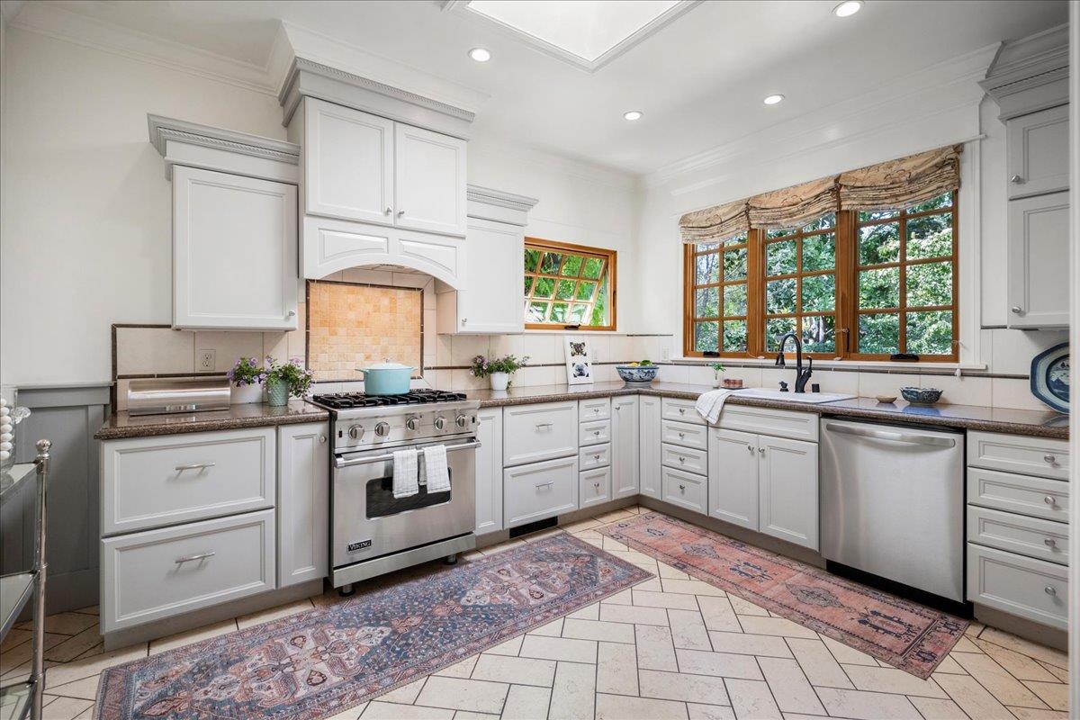32 Maple Avenue Atherton, CA 94027 - Photo 17 of 52 a kitchen with a stove sink and cabinets