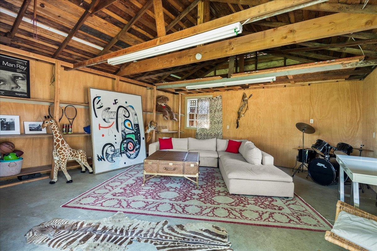 32 Maple Avenue Atherton, CA 94027 - Photo 40 of 52 a living room with patio furniture and a rug