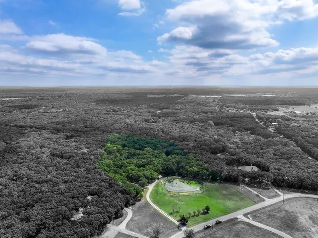 a view of a swimming pool with a yard