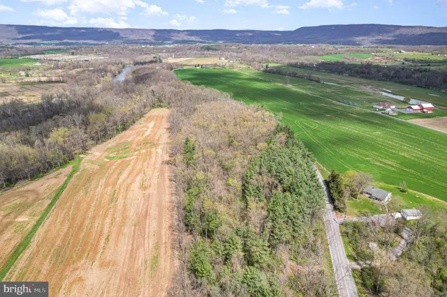 a view of a lake with a yard