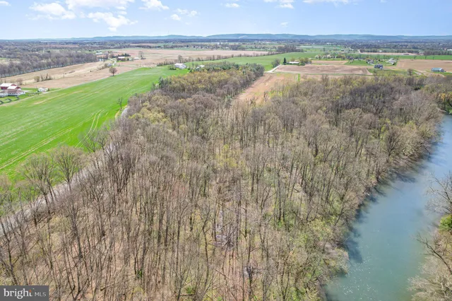 a view of a lake with a yard