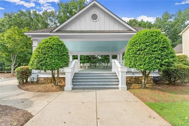 a front view of a house with garden