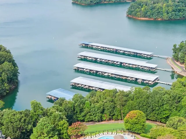 a backyard of a house with lots of green space and plants