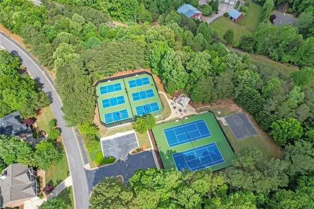 an aerial view of a house with a yard and garden