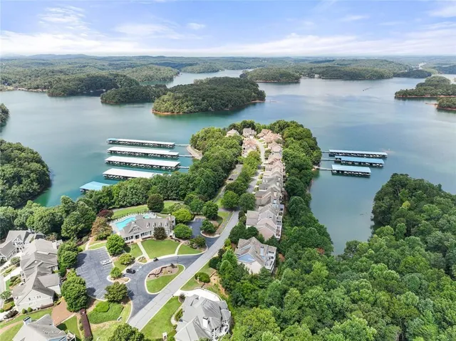 an aerial view of a house with outdoor space and lake view