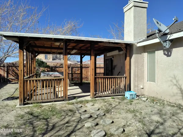 a view of a porch with a small yard