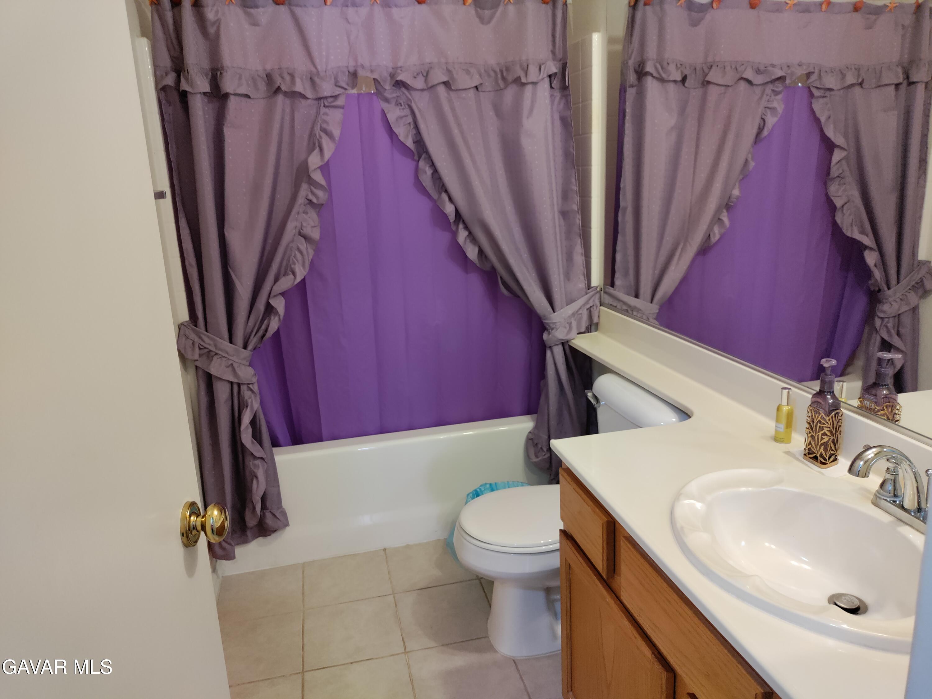 37759 67th Street East Palmdale, CA 93552 - Photo 17 of 27 a bathroom with a sink a toilet and a shower