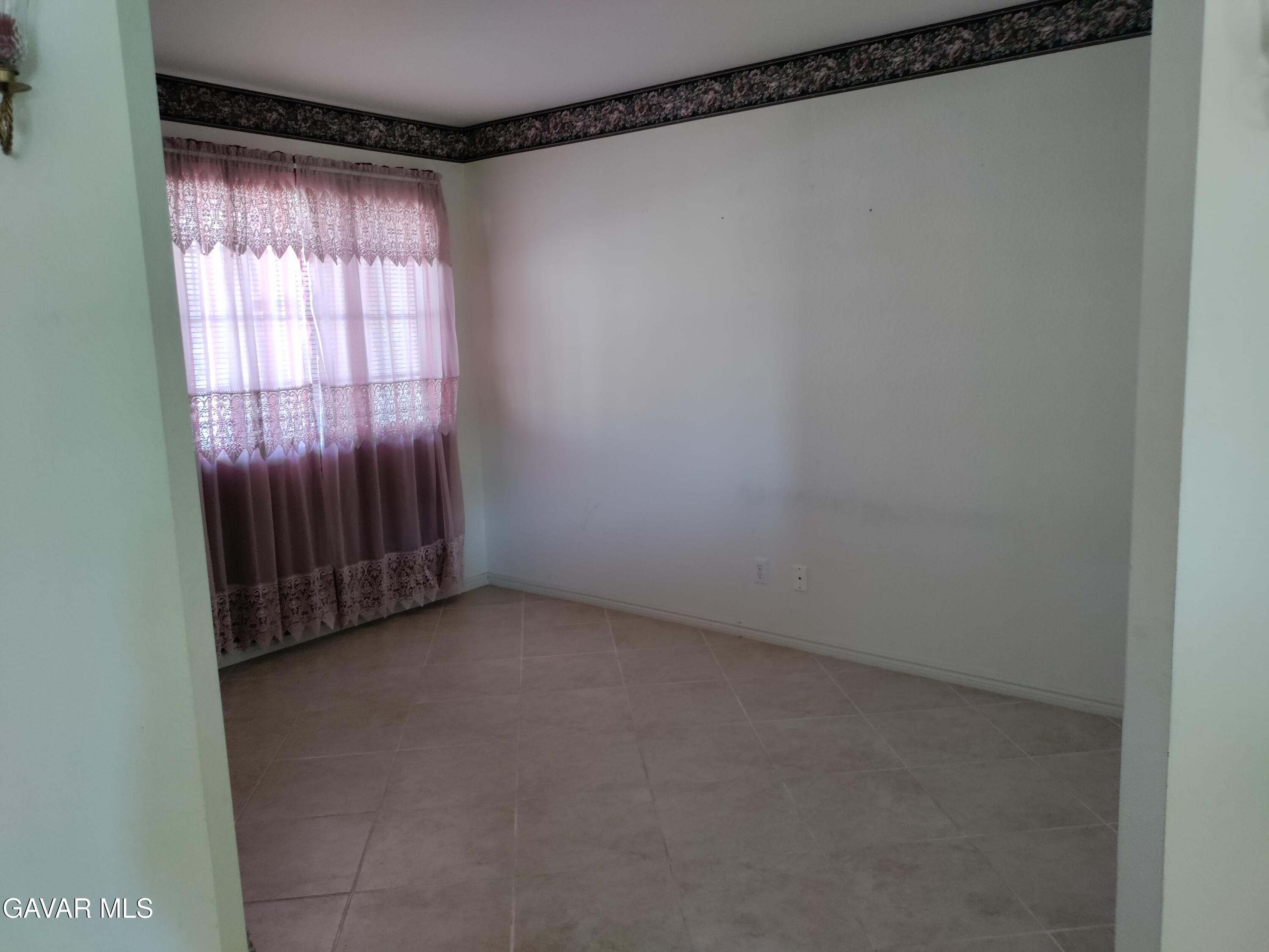 37759 67th Street East Palmdale, CA 93552 - Photo 20 of 27 a view of an empty room and window