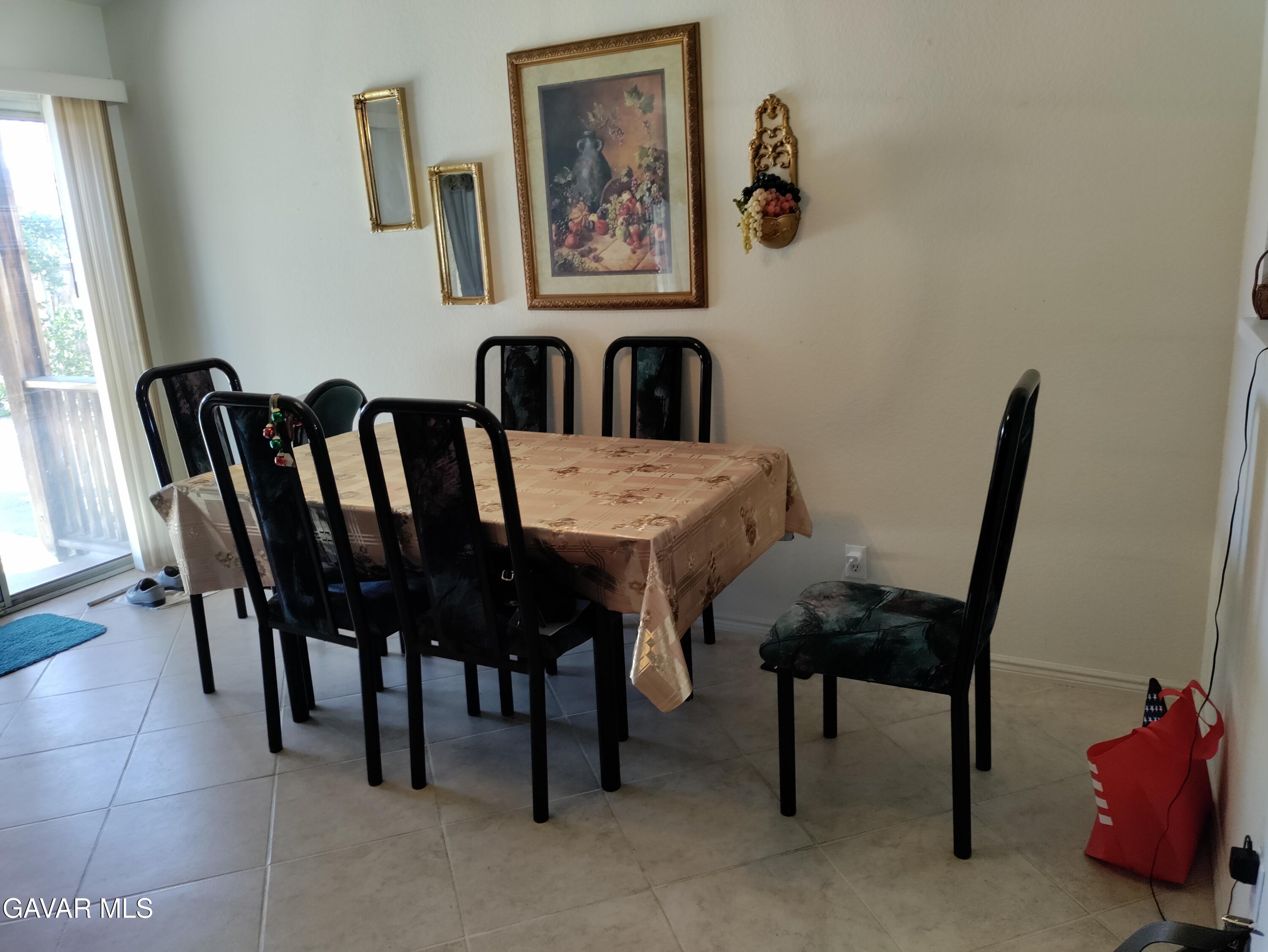 37759 67th Street East Palmdale, CA 93552 - Photo 8 of 27 a view of a dining room with furniture and wooden floor