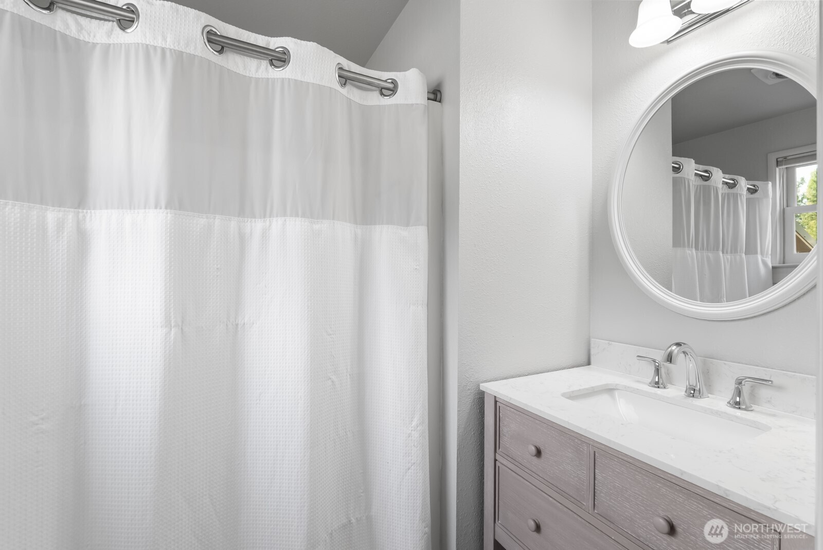 501 3rd Street Steilacoom, WA 98388 - Photo 20 of 40 a bathroom with a sink vanity mirror and tub