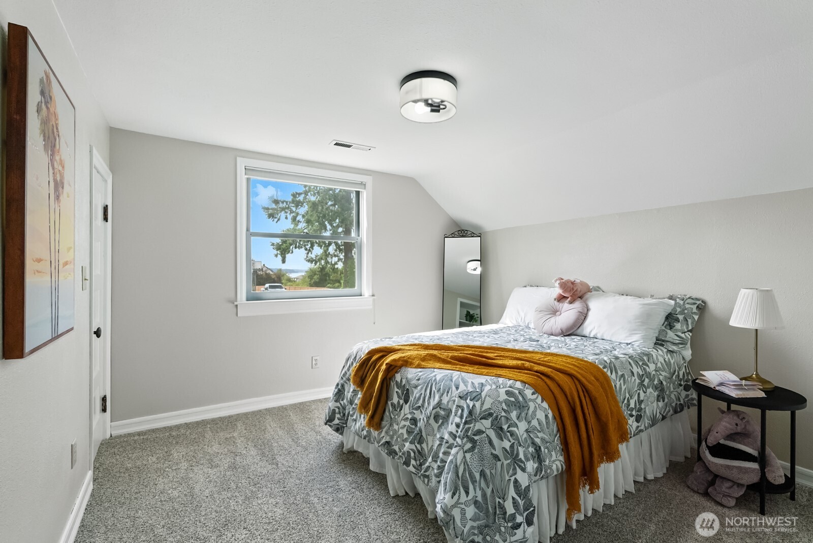 501 3rd Street Steilacoom, WA 98388 - Photo 23 of 40 a bedroom with a bed and a window
