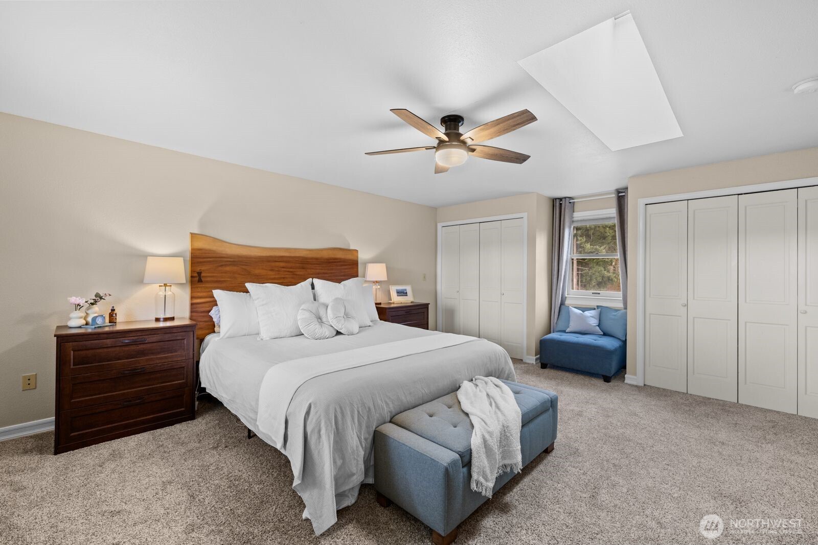 501 3rd Street Steilacoom, WA 98388 - Photo 30 of 40 a bedroom with a bed and a chandelier