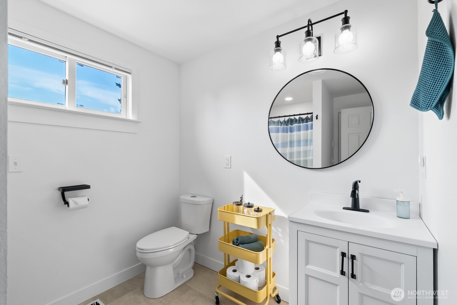 501 3rd Street Steilacoom, WA 98388 - Photo 34 of 40 a bathroom with a toilet a sink and a mirror
