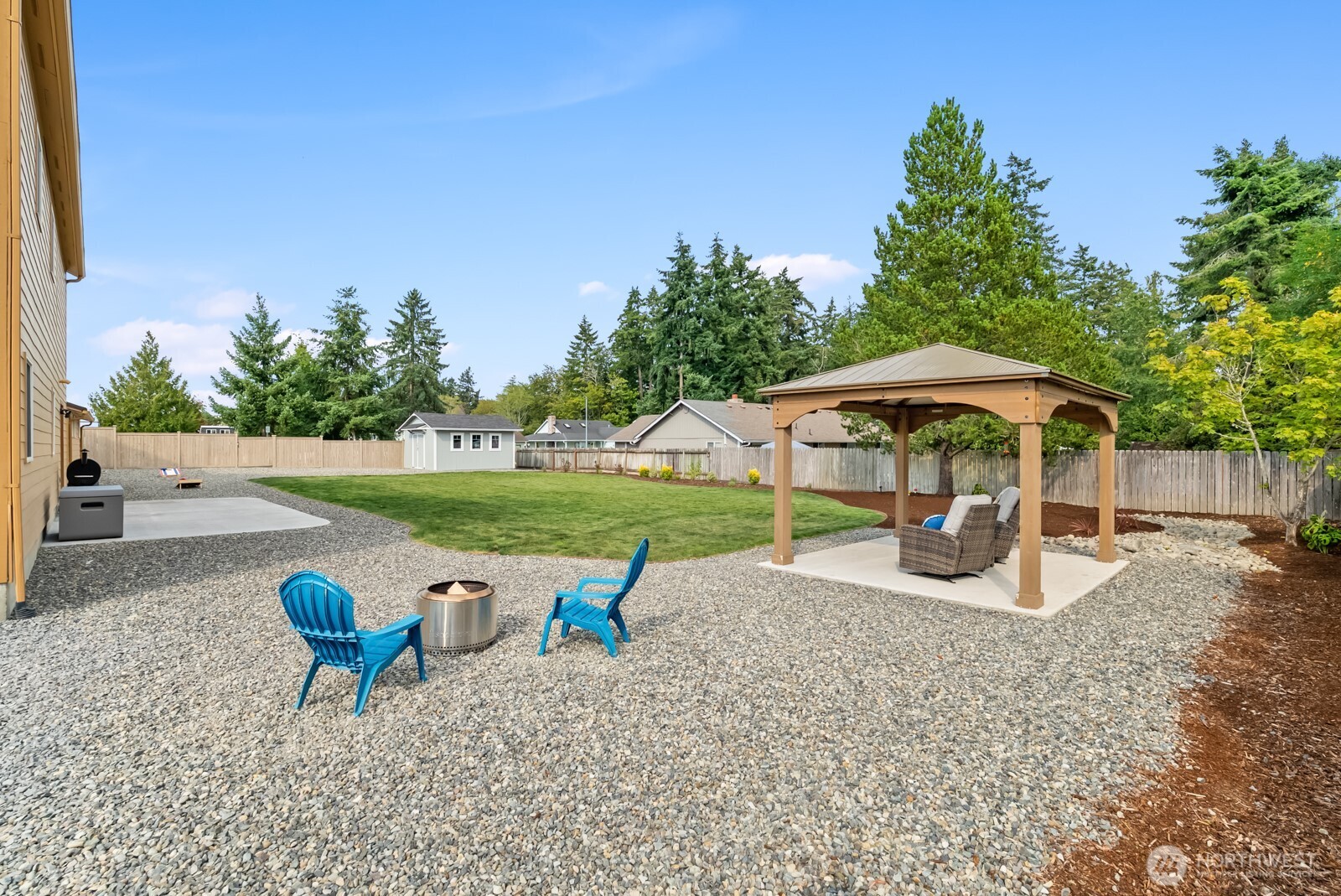 501 3rd Street Steilacoom, WA 98388 - Photo 35 of 40 a view of a table and chairs under an umbrella