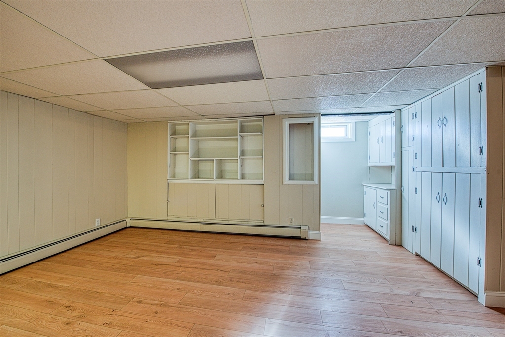 40 Lyndon Road Sharon, MA 02067 - Photo 20 of 23 an empty room with wooden floor and windows