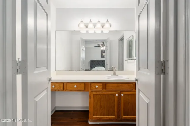 a white toilet sitting next to a bathroom sink