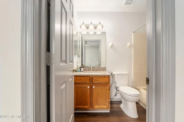 an aerial view of a house with yard and outdoor seating