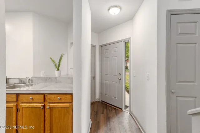 a kitchen with stainless steel appliances granite countertop a stove a refrigerator and a sink