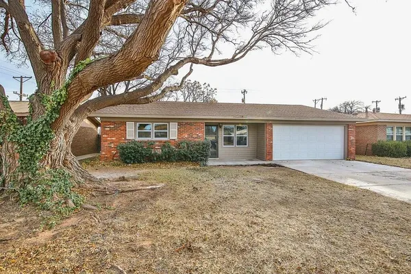 front view of a house with a dry yard