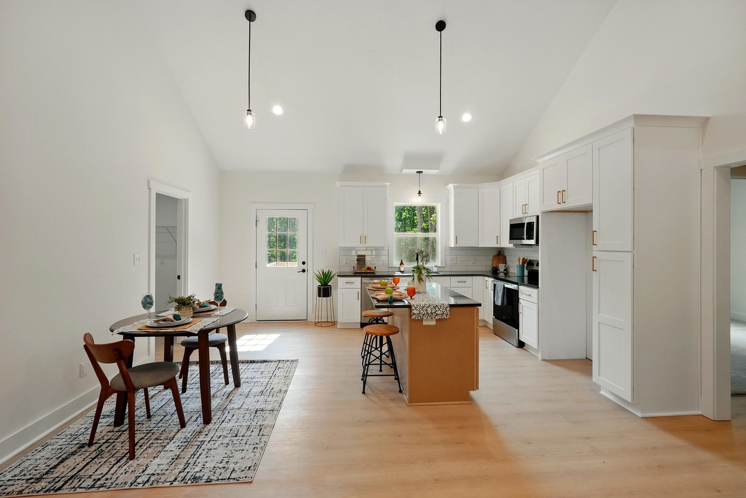 Lot 20 Johnson Mountain Road Huddleston, VA 24104 - Photo 7 of 30 a living room with stainless steel appliances kitchen island granite countertop furniture and a wooden floor