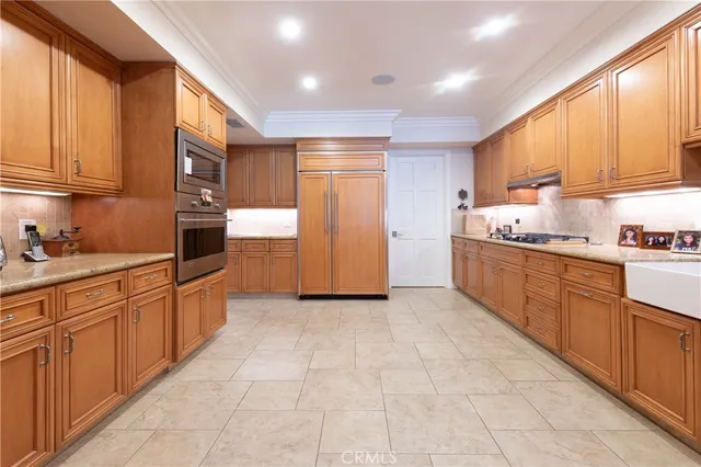 a kitchen with stainless steel appliances granite countertop a sink and cabinets