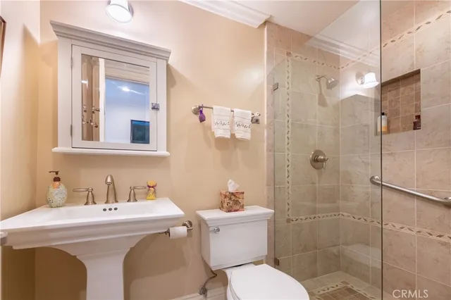 a bedroom with furniture and a fireplace