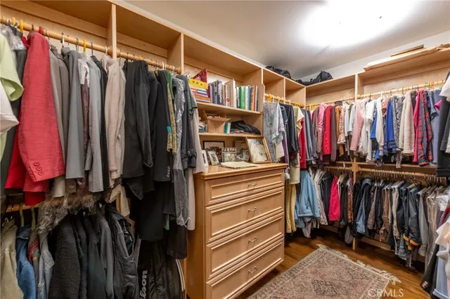 a view of a hallway view with wooden floor and furniture