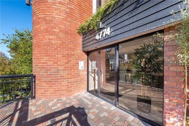 a view of a door and a wooden bench
