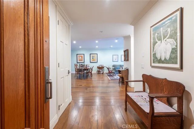 a view of a dining room with furniture wooden floor and a chandelier