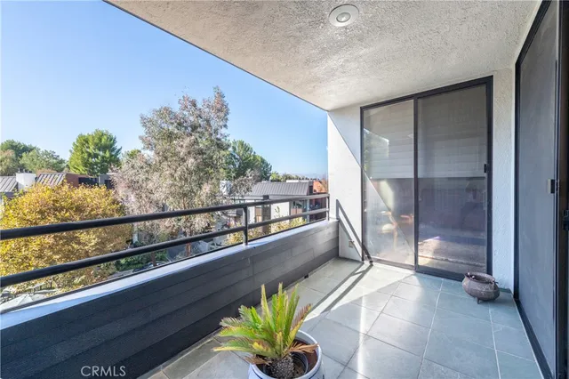 a view of a balcony with chairs