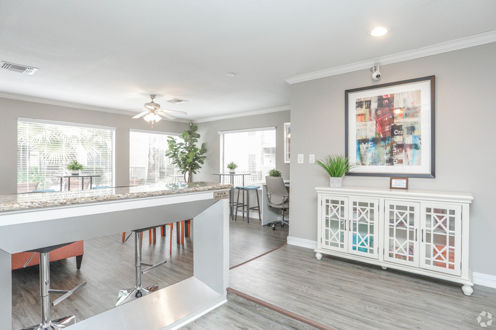 10250 Lands End Drive, Unit 410 Houston, TX 77099 - Photo 12 of 27 a living room with furniture a large window and wooden floor