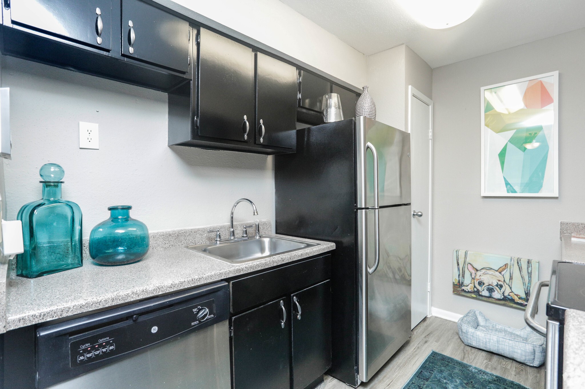 10250 Lands End Drive, Unit 410 Houston, TX 77099 - Photo 13 of 27 a kitchen with stainless steel appliances a sink a refrigerator and a counter top space
