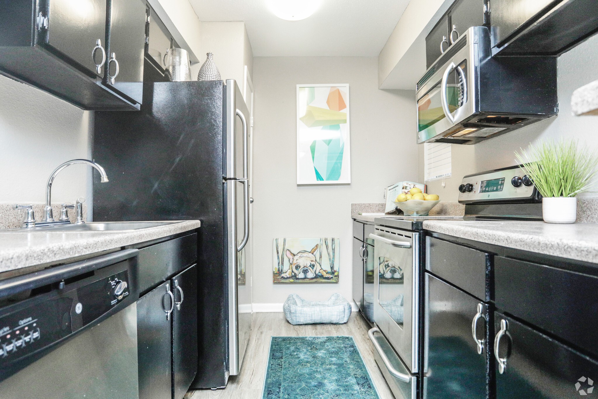 10250 Lands End Drive, Unit 410 Houston, TX 77099 - Photo 4 of 27 a kitchen with a sink appliances and cabinets