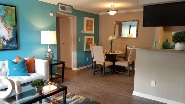 a living room with furniture and a flat screen tv