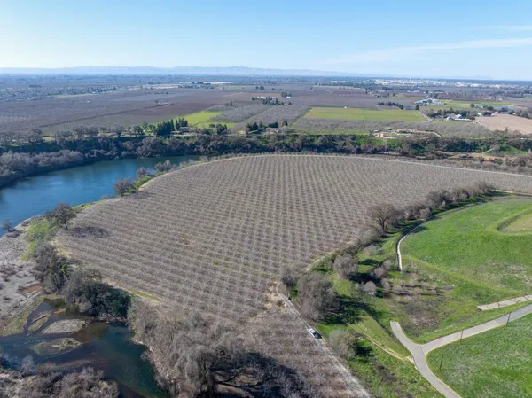 an aerial view of a houses with a lake view