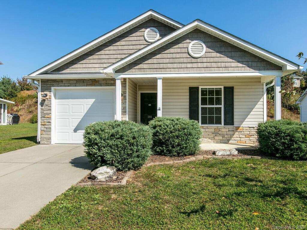 244 Lumber River Road Fletcher, NC 28732 - Photo 2 of 36 front view of a house with a yard