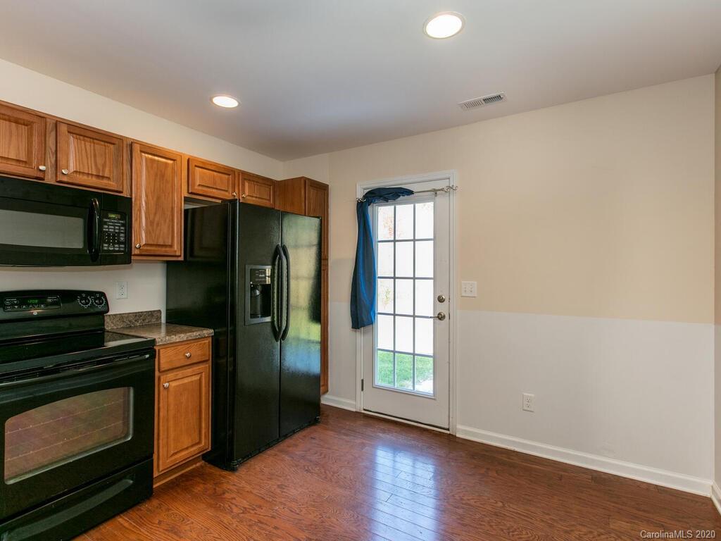244 Lumber River Road Fletcher, NC 28732 - Photo 15 of 36 a kitchen with stainless steel appliances a refrigerator stove and microwave