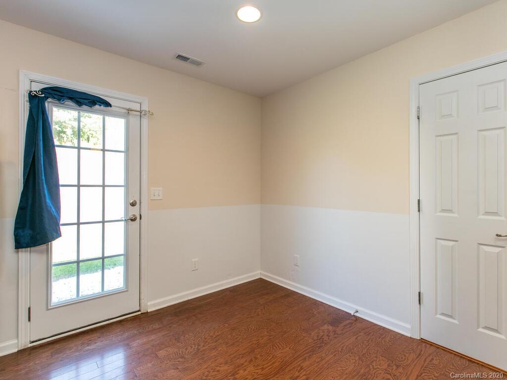 244 Lumber River Road Fletcher, NC 28732 - Photo 16 of 36 an empty room with wooden floor and windows