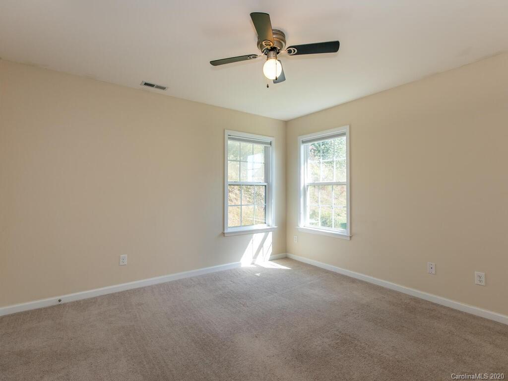 244 Lumber River Road Fletcher, NC 28732 - Photo 17 of 36 a view of an empty room with a window