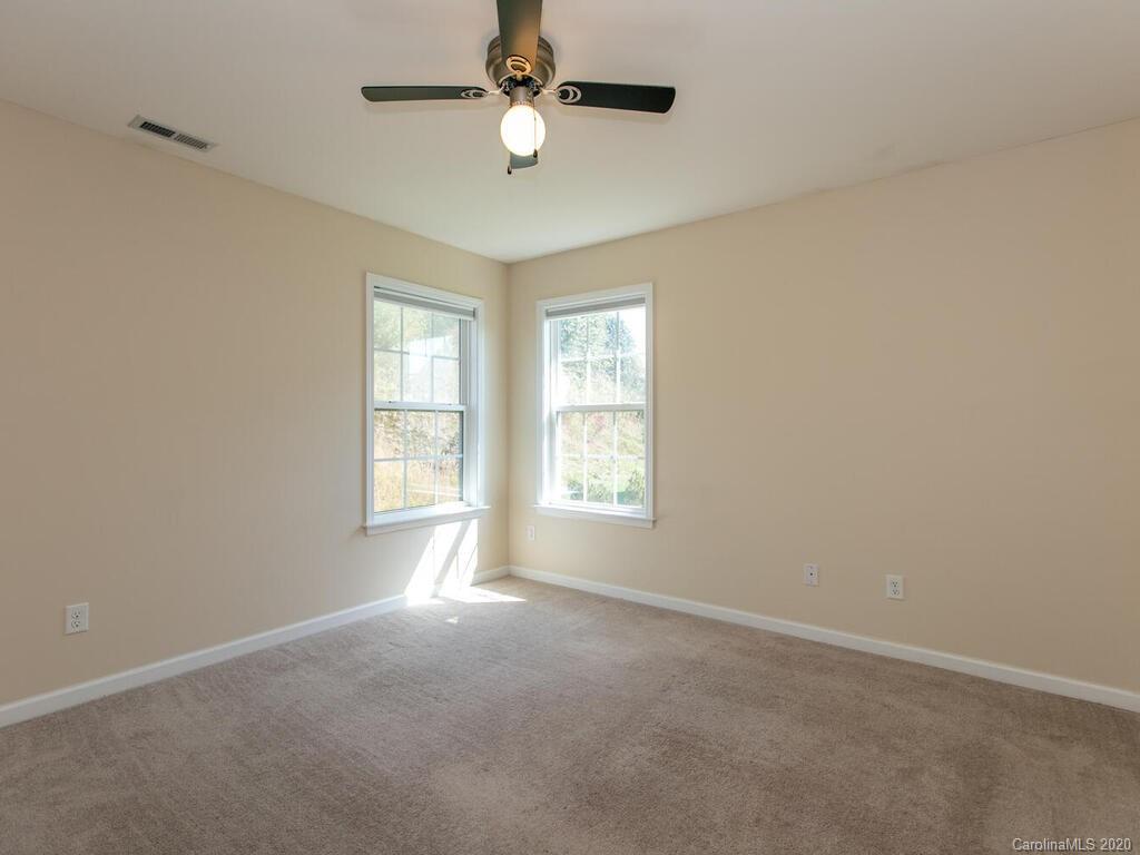 244 Lumber River Road Fletcher, NC 28732 - Photo 18 of 36 a view of an empty room with a window
