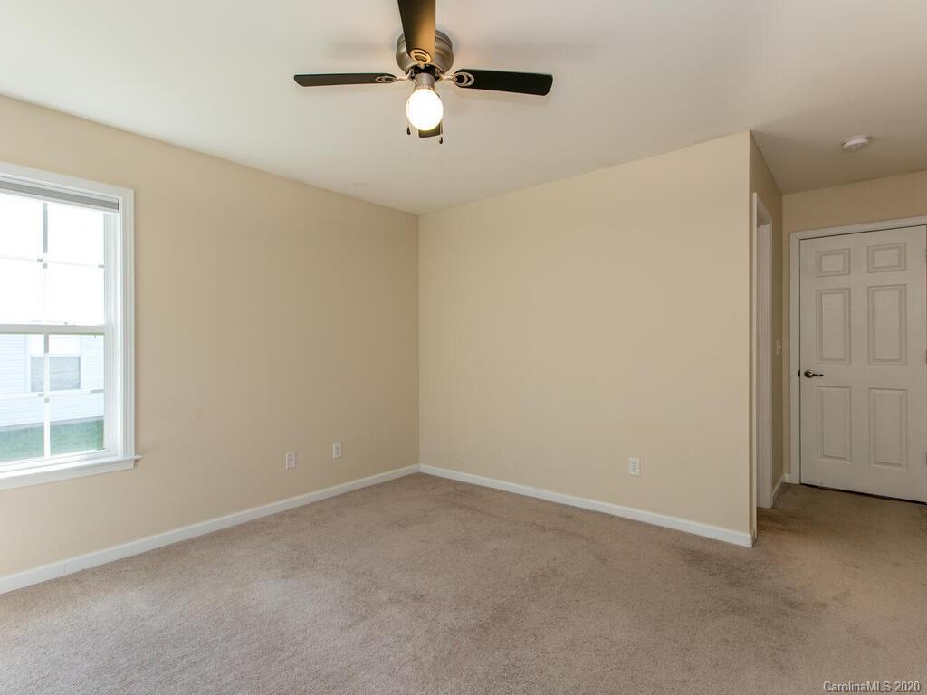 244 Lumber River Road Fletcher, NC 28732 - Photo 19 of 36 an empty room with a window