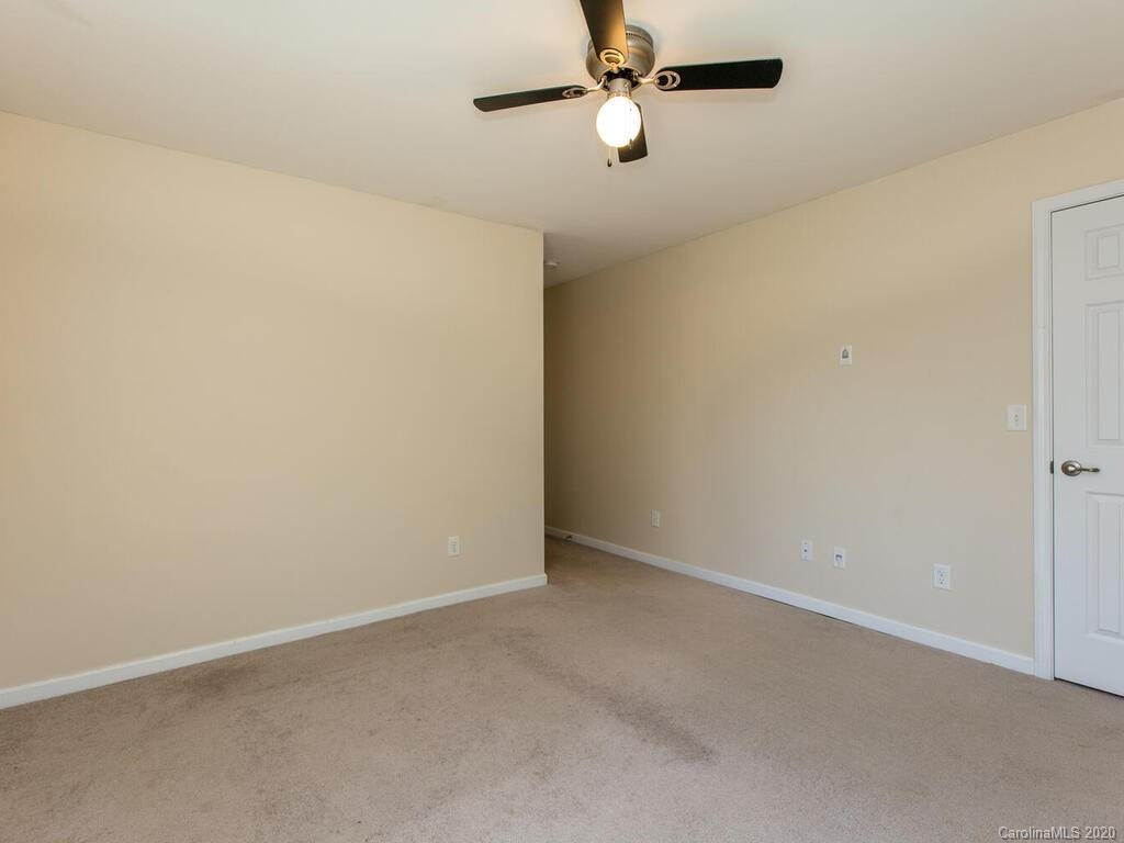 244 Lumber River Road Fletcher, NC 28732 - Photo 20 of 36 an empty room with a ceiling fan and a window
