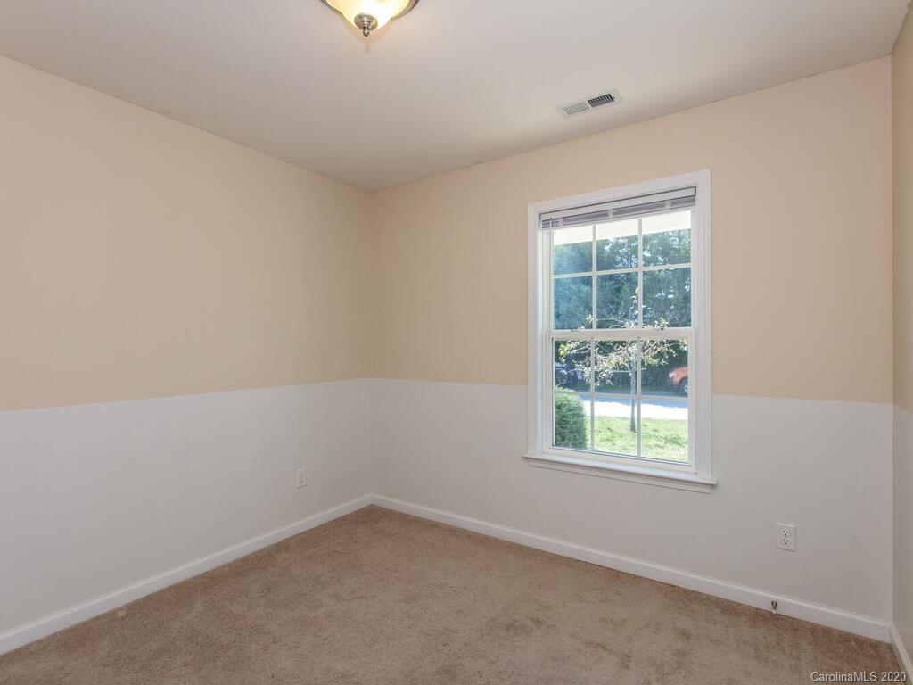 244 Lumber River Road Fletcher, NC 28732 - Photo 23 of 36 an empty room with a window