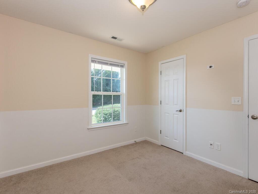 244 Lumber River Road Fletcher, NC 28732 - Photo 24 of 36 an empty room with a window
